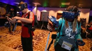 Guests exploring an XR installation with handheld controllers.